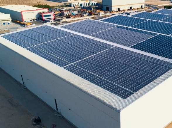 Solar panels installed on an industrial factory rooftop